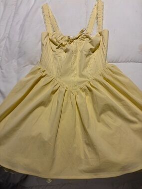 NWOT.  Ladies springtime yellow dress.  Lace on bottom.